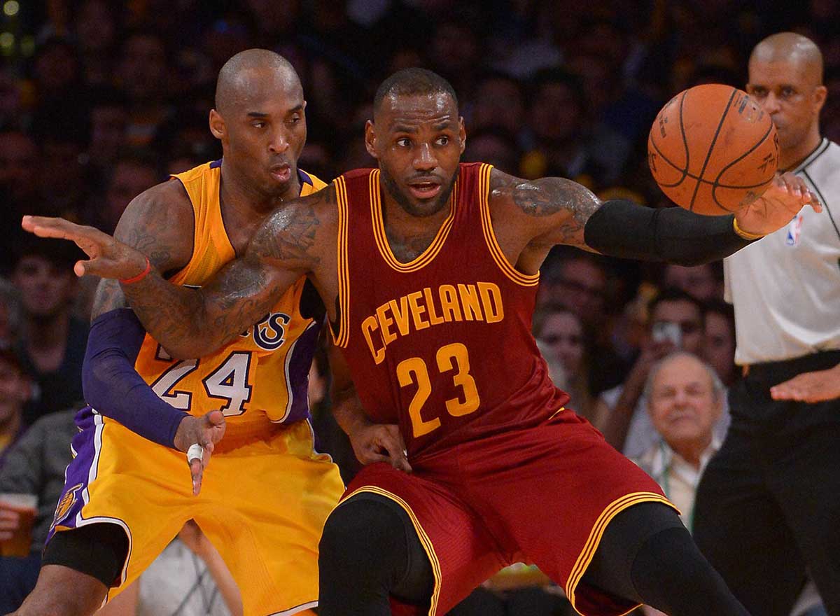 Mar 10, 2016; Los Angeles, CA, USA; Los Angeles Lakers forward Kobe Bryant (24) guards Cleveland Cavaliers forward LeBron James (23) on the court in the first half of the game at Staples Center.