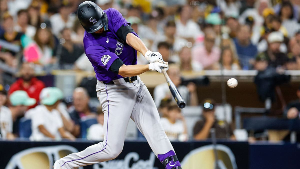 Aug 2, 2024; San Diego, California, USA; Colorado Rockies right fielder Kris Bryant (23) hits a two run single during the sixth inning against the San Diego Padres at Petco Park. 