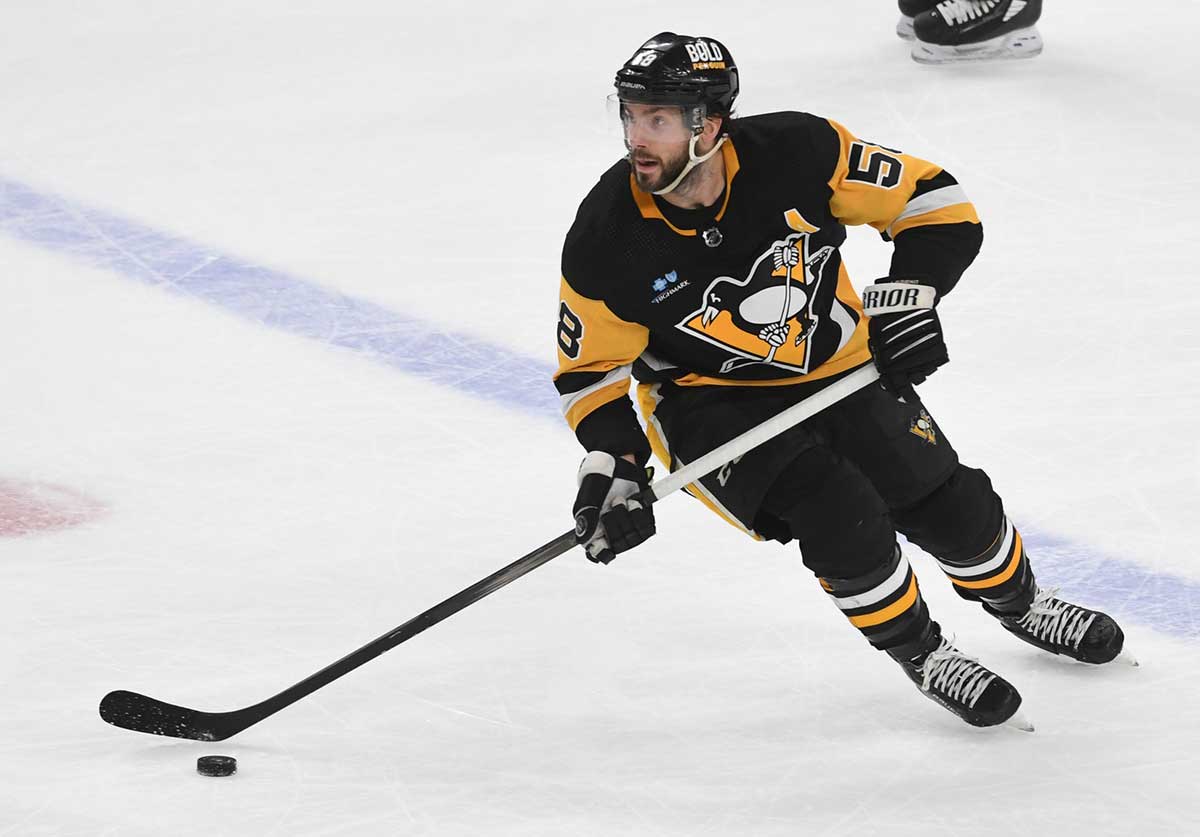 Pittsburgh Penguins defenseman Kris Letang (58) moves the puck against the Boston Bruins at PPG Paints Aren
