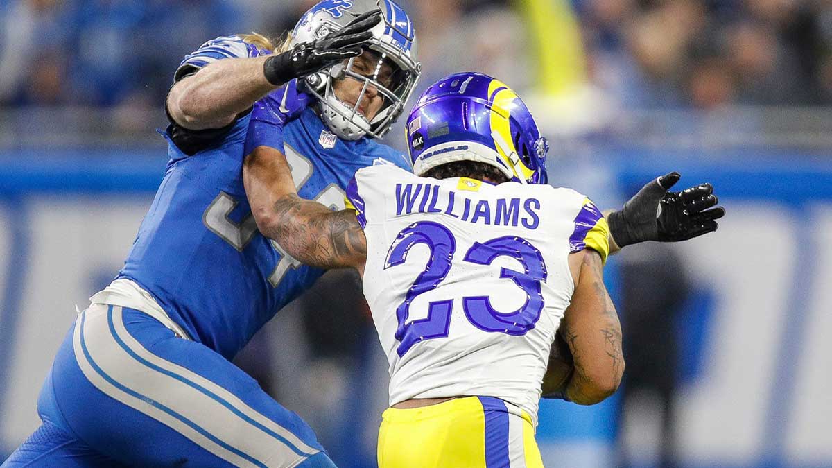 Detroit Lions linebacker Alex Anzalone tackles L.A. Rams running back Kyren Williams during the first half of the NFC wild-card game at Ford Field in Detroit on Sunday, Jan, 14, 2024.