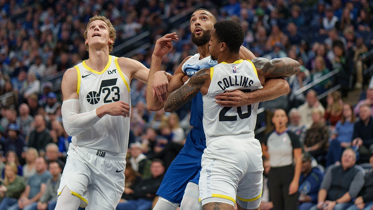 Utah Jazz forward Lauri Markkanen (23) shoots a three point shot against Dallas Mavericks forward P.J. Washington (25) during the second quarter at Delta Center.