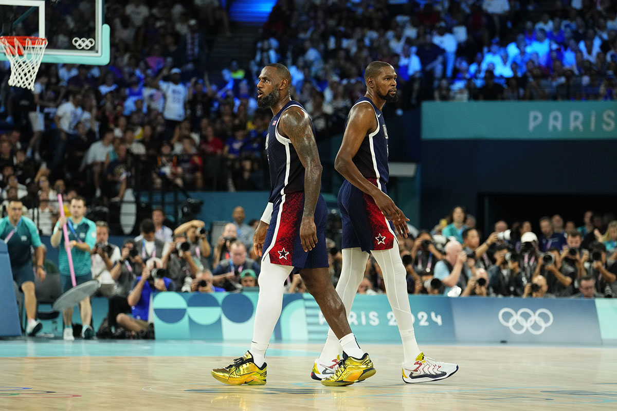 United States guard LeBron James (6) and guard Kevin Durant (7) react in the second half against France in the men's basketball gold medal game during the Paris 2024 Olympic Summer Games at Accor Arena.