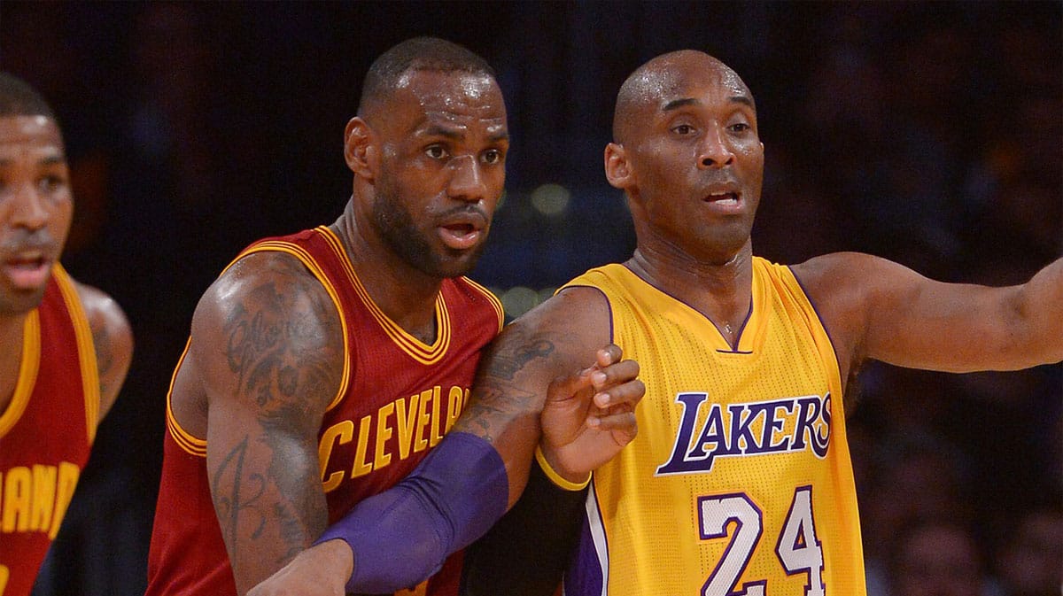 Cleveland Cavaliers forward LeBron James (23) and Los Angeles Lakers forward Kobe Bryant (24) battle for position in the first quarter of the game at Staples Center.