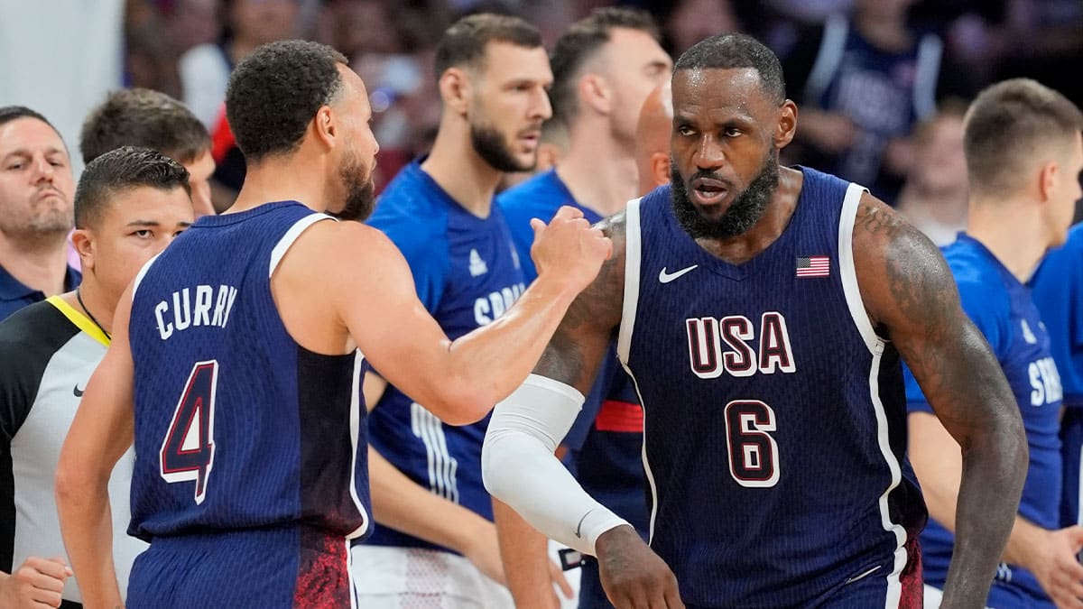 United States guard Lebron James (6) and shooting guard Stephen Curry (4) celebrate after a play in the third quarter against Serbia during the Paris 2024 Olympic Summer Games at Stade Pierre-Mauroy. 
