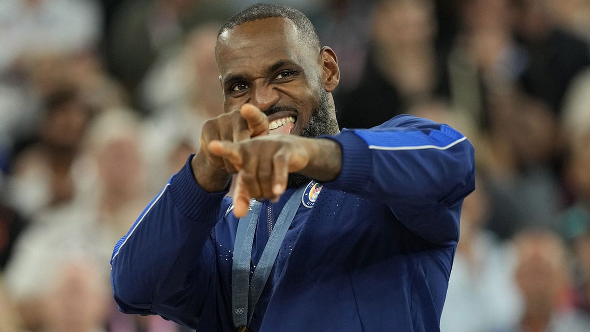 United States guard LeBron James (6) celebrates with the gold medal after the game against France in the men's basketball gold medal game during the Paris 2024 Olympic Summer Games at Accor Arena.