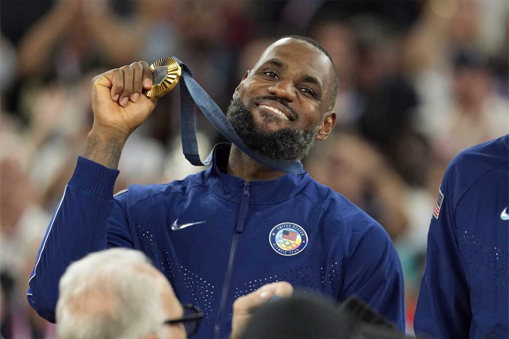 United States guard LeBron James (6) celebrates with the gold medal after the game against France in the men's basketball gold medal game during the Paris 2024 Olympic Summer Games at Accor Arena. 