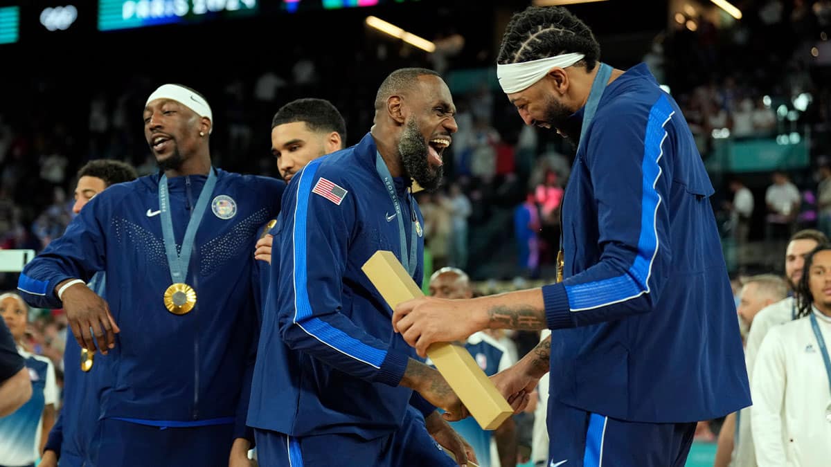 Team USA guard LeBron James (6) and centre Anthony Davis (14) celebrate after defeating France in the men's basketball gold medal game during the Paris 2024 Olympics Summer Games at Accor Arena