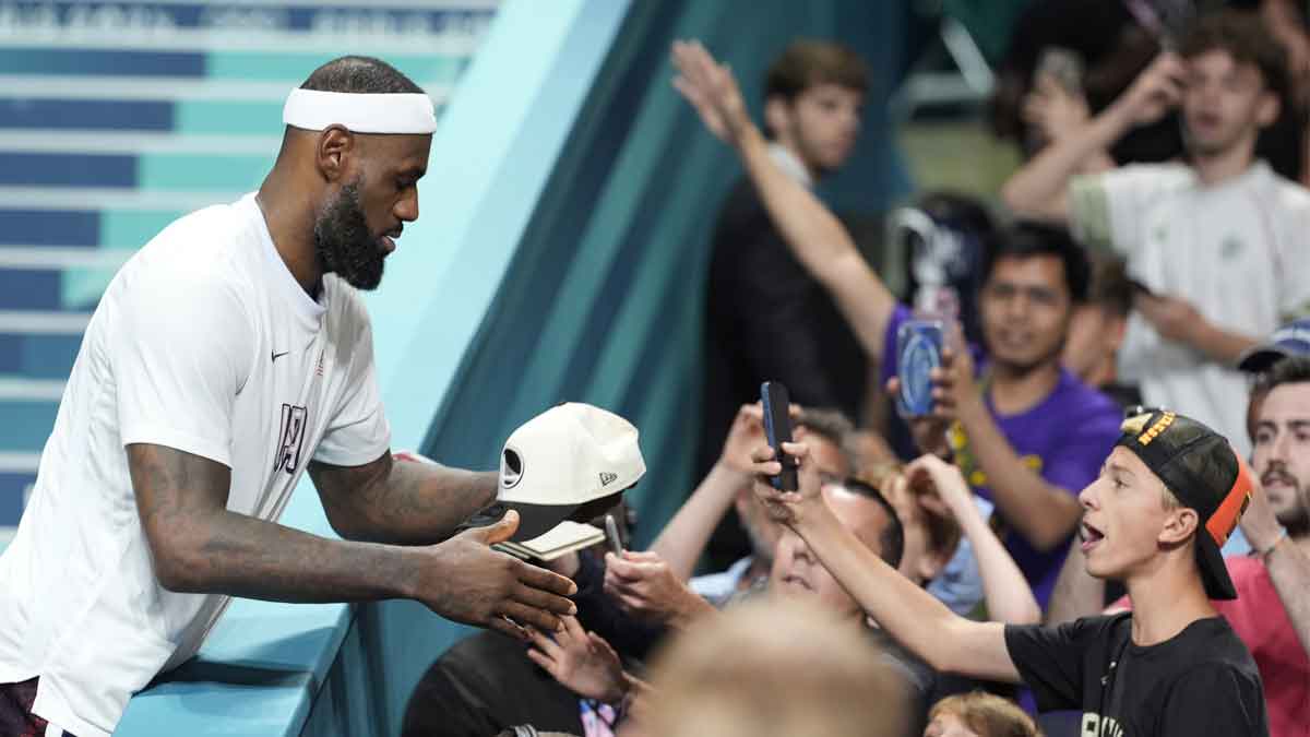 Aug 3, 2024; Villeneuve-d'Ascq, France; United States guard LeBron James (6) signs autographs after defeating Puerto Rico during the Paris 2024 Olympic Summer Games at Stade Pierre-Mauroy