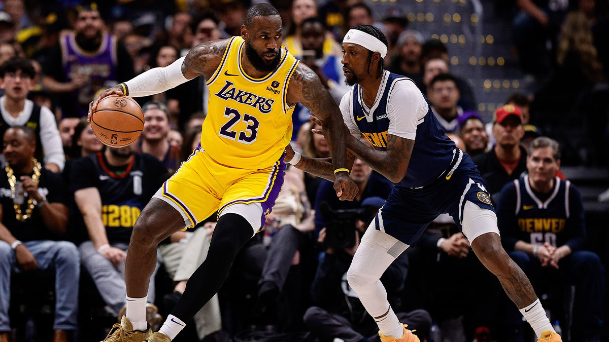 LeBron James (23) controls the ball as Denver Nuggets guard Kentavious Caldwell-Pope (5) guards