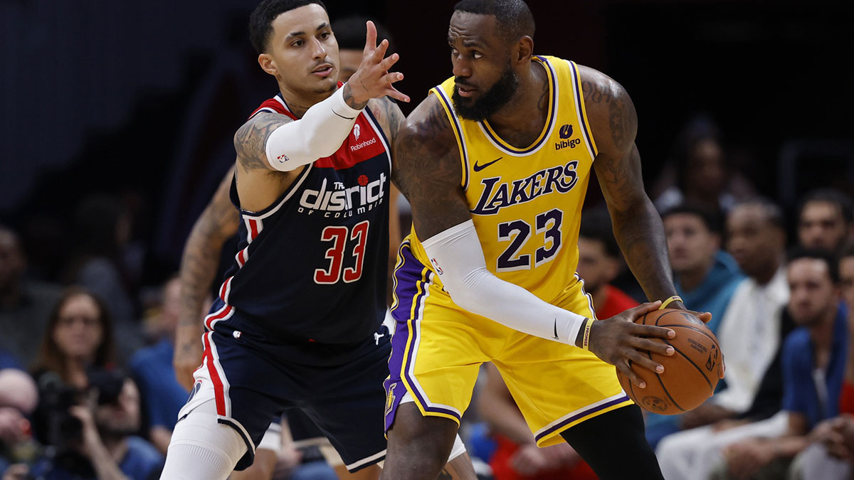 Los Angeles Lakers forward LeBron James (23) holds the ball as Washington Wizards forward Kyle Kuzma (33) defends in the second half at Capital One Arena.