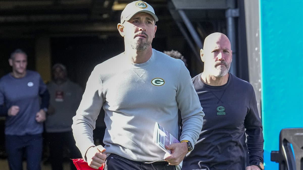 Green Bay Packers head coach Matt LeFleur runs onto the field during the first quarter against the Carolina Panthers at Bank of America Stadium