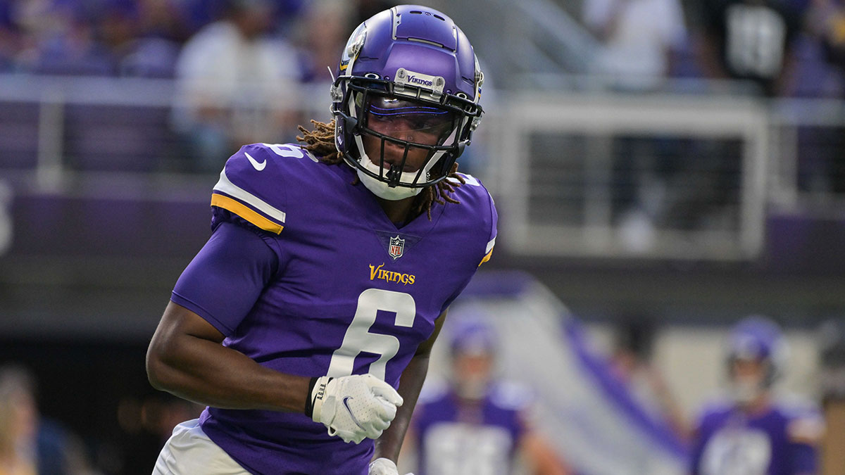 Minnesota Vikings safety Lewis Cine (6) warms up before the game against the San Francisco 49ers at U.S. Bank Stadium. 