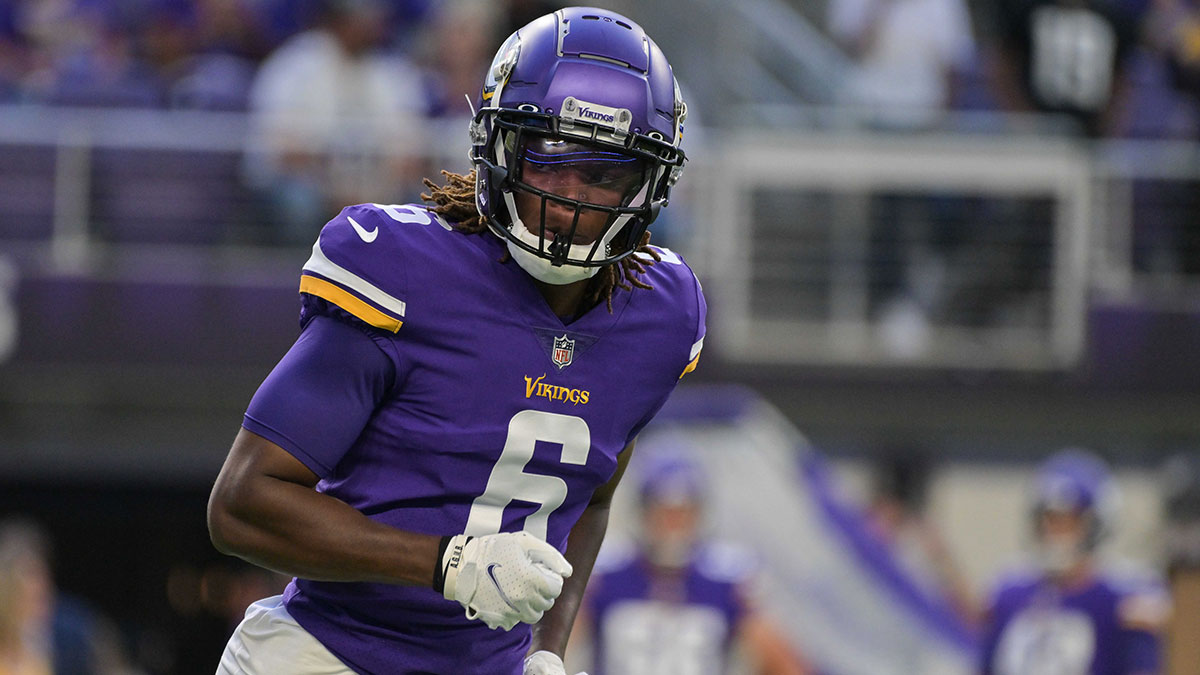 Minnesota Vikings safety Lewis Cine (6) warms up before the game against the San Francisco 49ers at U.S. Bank Stadium.