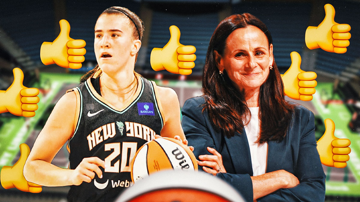 WNBA New York Liberty player Sabrina Ionescu, with the thumbs up emoji on a basketball court, with New York Liberty coach Sandy Brondello