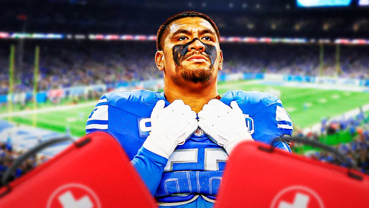 Lions Penei Sewell with a medical kit next to him.