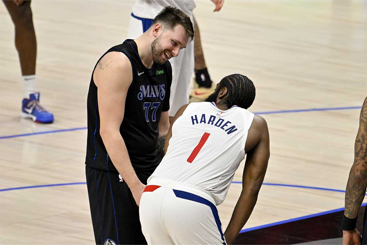 Dallas Mavericks guard Luka Doncic (77) jokes with LA Clippers guard James Harden (1) during the fourth quarter during game six of the first round for the 2024 NBA playoffs at American Airlines Center.