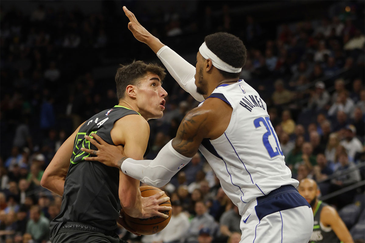 Minnesota Timberwolves center Luka Garza (55) works around Dallas Mavericks center Richaun Holmes (20) in the fourth quarter at Target Center. 