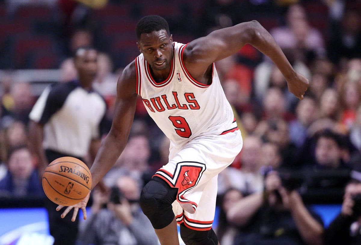 Luol Deng with the ball during the first quarter against the Toronto Raptors at the United Center. Mandatory Credit: Dennis Wierzbicki-USA TODAY Sports