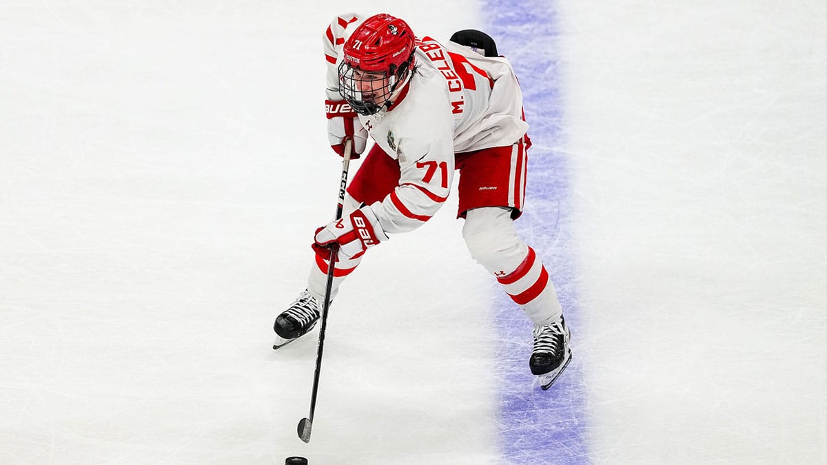 Boston U forward Macklin Celebrini (71) carries the puck in the semifinals of the 2024 Frozen Four college ice hockey tournament during the second period against Denver at Xcel Energy Center.