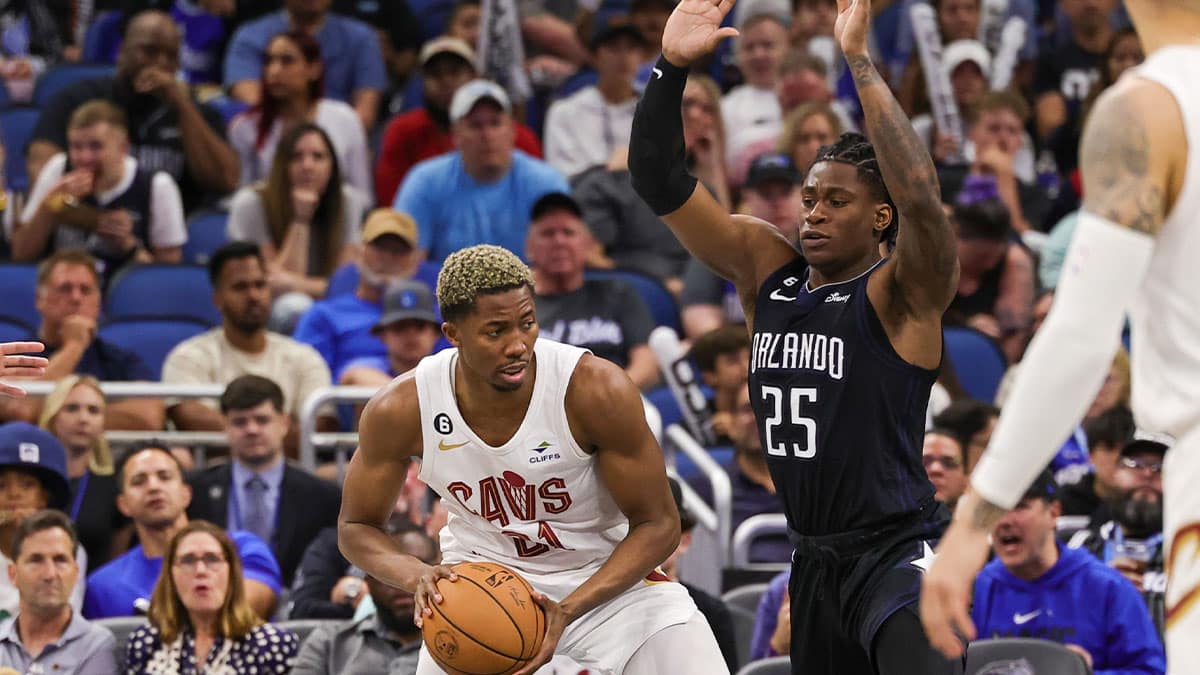 Apr 6, 2023; Orlando, Florida, USA; Orlando Magic forward Admiral Schofield (25) defends Cleveland Cavaliers forward Mamadi Diakite (21) during the second half at Amway Center. 