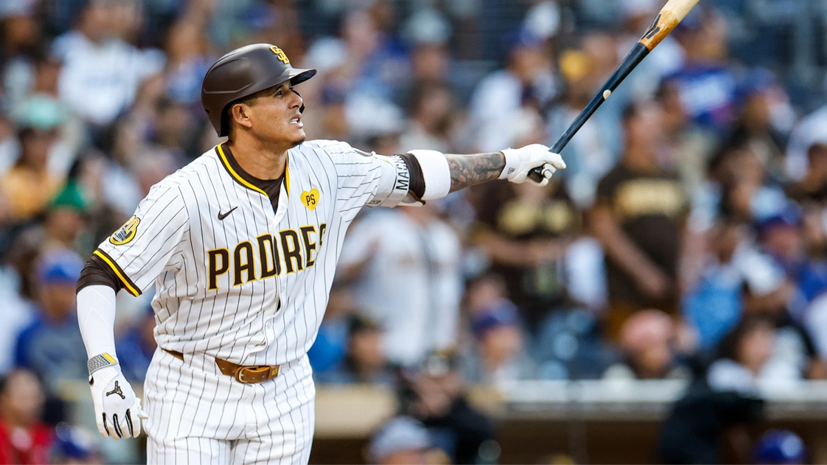 San Diego Padres third baseman Manny Machado (13) watches the ball fly over the center field wall for a one-run home run during the second inning against the Los Angeles Dodgers at Petco Park.