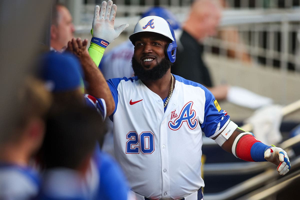 Aug 3, 2024; Atlanta, Georgia, USA; Atlanta Braves designated hitter Marcell Ozuna (20) celebrates with teammates after a home run against the Miami Marlins in the third inning at Truist Park