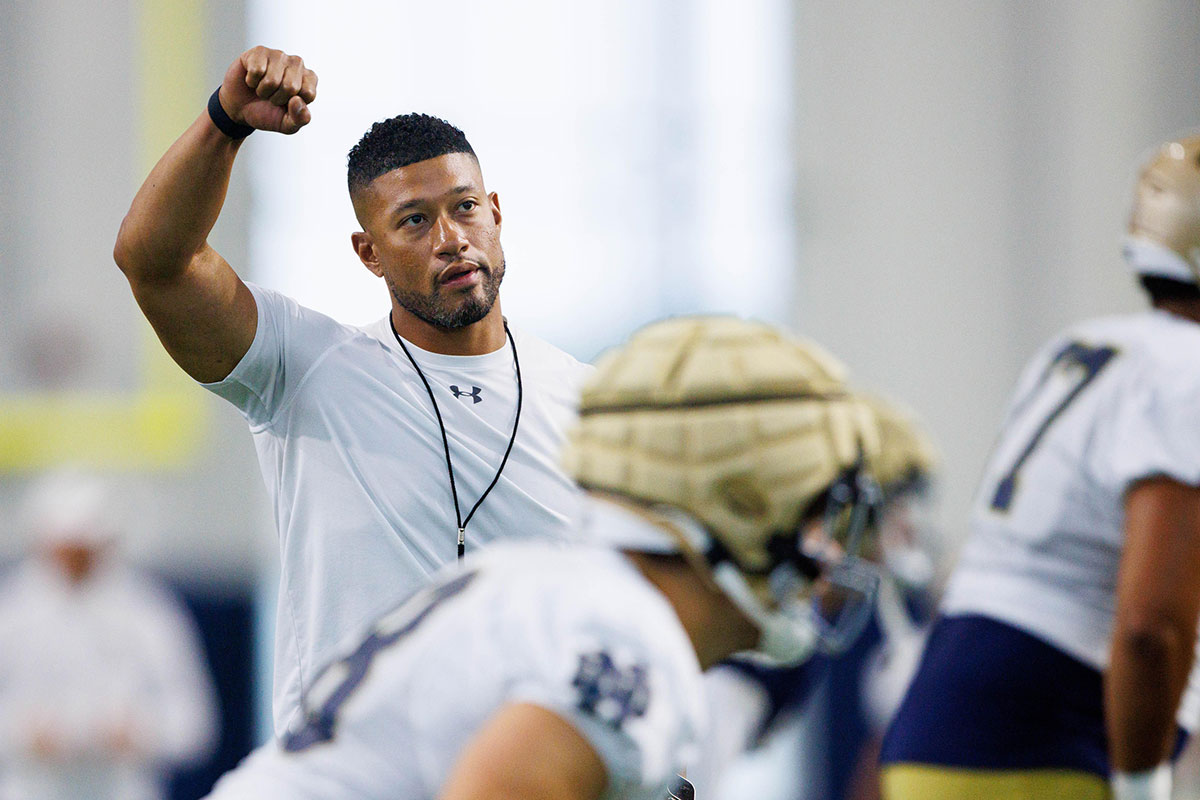 Notre Dame head coach Marcus Freeman warms up during a Notre Dame football practice at Irish Athletic Center
