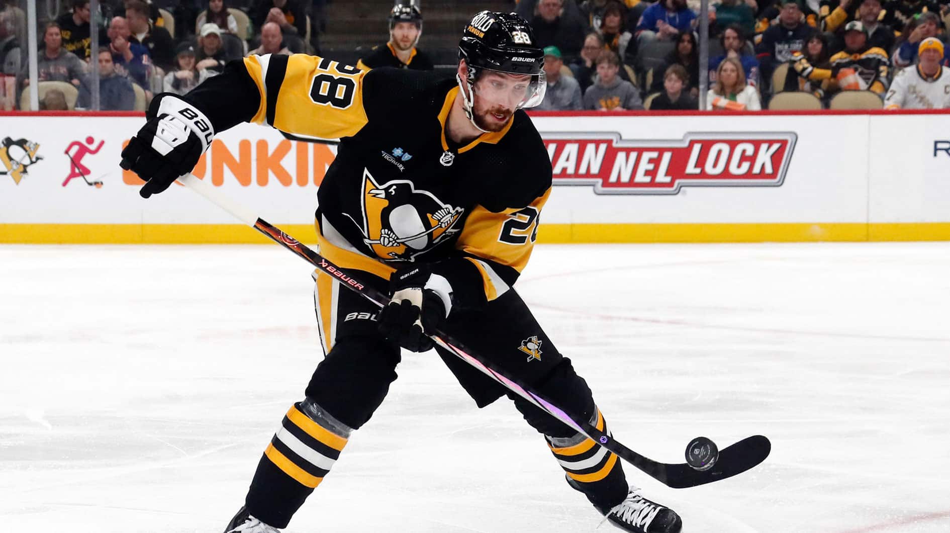 Pittsburgh Penguins defenseman Marcus Pettersson (28) clears the puck against the New York Rangers during the second period at PPG Paints Arena.