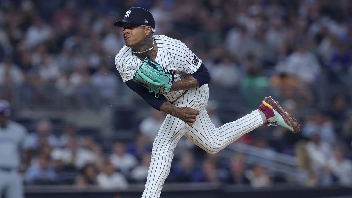 New York Yankees starting pitcher Marcus Stroman (0) follows through on a pitch against the Toronto Blue Jays during the first inning at Yankee Stadium.