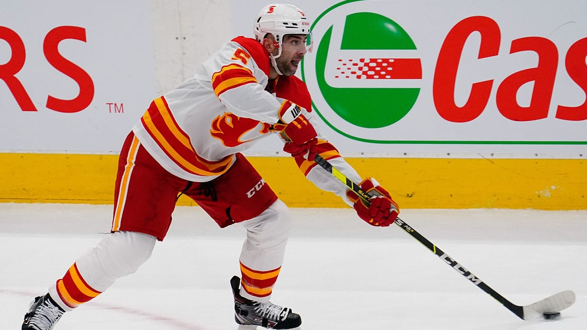 Calgary Flames defenseman Mark Giordano (5) passes the puck against the Toronto Maple Leafs at Scotiabank Arena. Toronto defeated Calgary 2-1 in overtime. 