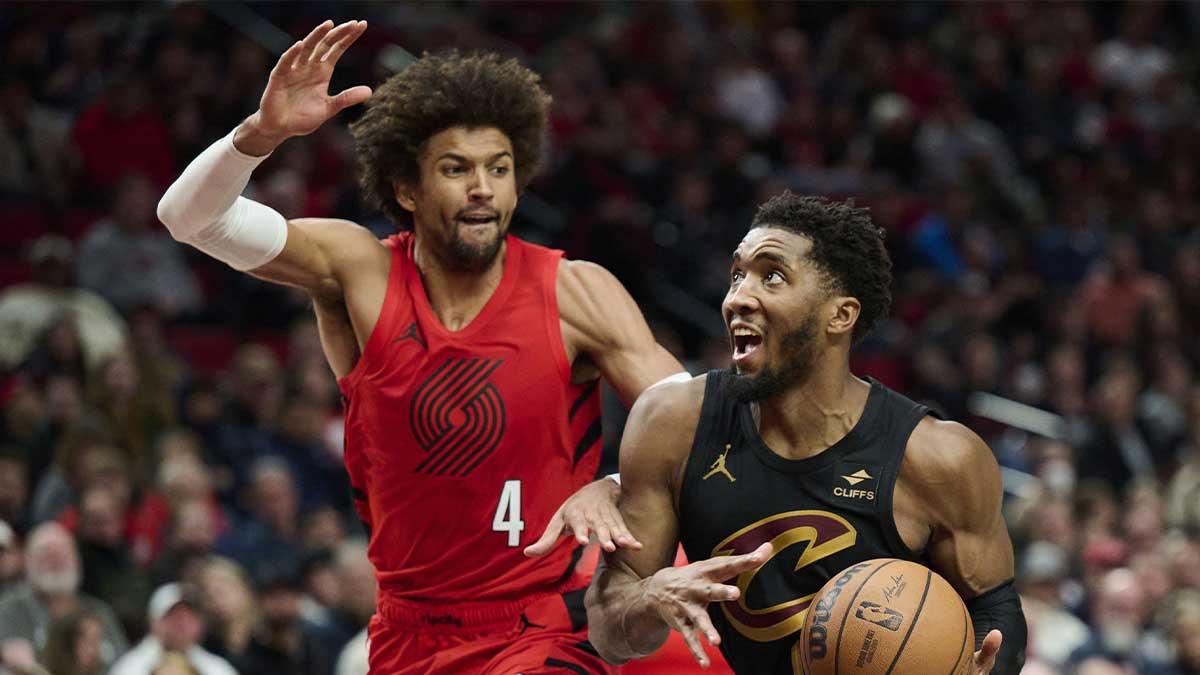 Cleveland Cavaliers guard Donovan Mitchell (45) drives to the basket during the second half against Portland Trail Blazers guard Matisse Thybulle (4) at Moda Center. 