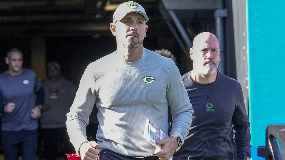 Green Bay Packers head coach Matt LaFleur runs onto the field during the first quarter against the Carolina Panthers at Bank of America Stadium.