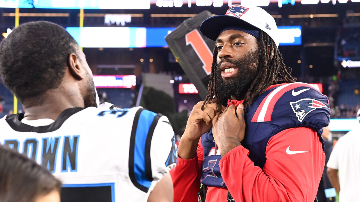 August 8, 2024; Foxborough, MA, USA; New England Patriots linebacker Matthew Judon (9) speaks to Carolina Panthers cornerback Anthony Brown (35) after a game at Gillette Stadium. Mandatory Credit: Eric Canha-USA TODAY Sports