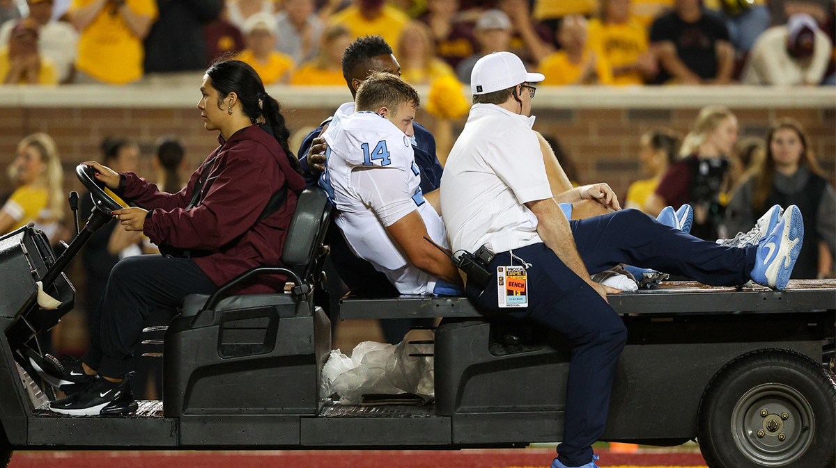 North Carolina Tar Heels quarterback Max Johnson (14) is carted off the field during the second half against the Minnesota Golden Gophers at Huntington Bank Stadium.