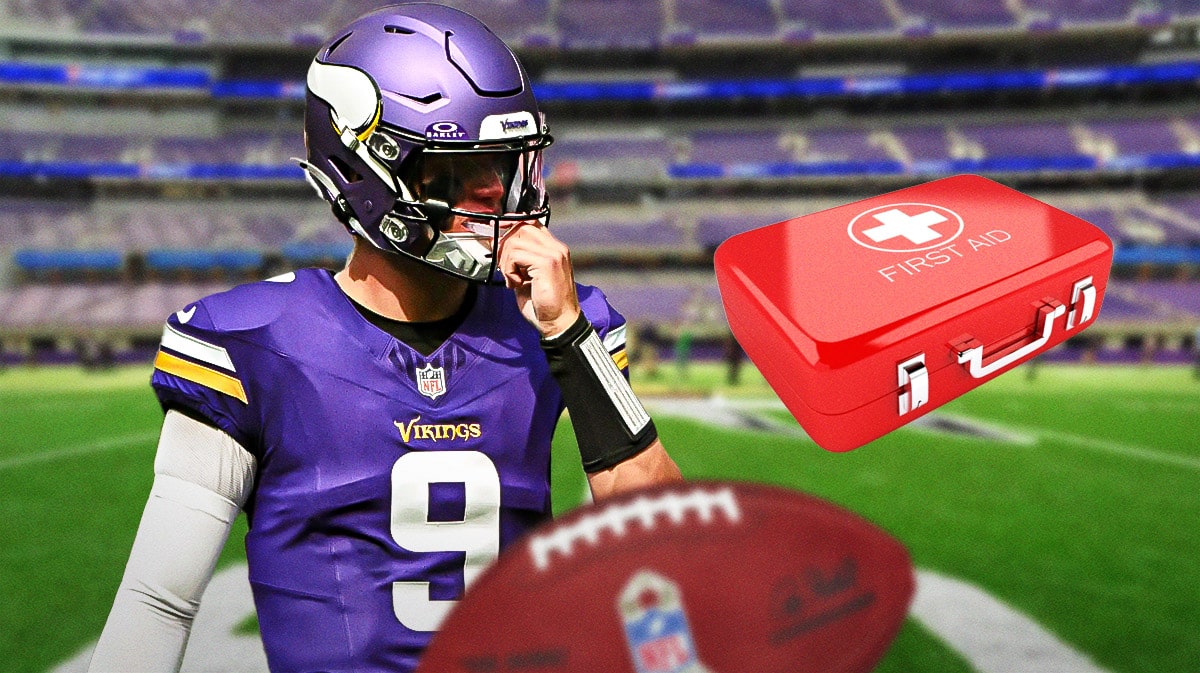 JJ McCarthy looking serious in Vikings jersey, medical kits around him.