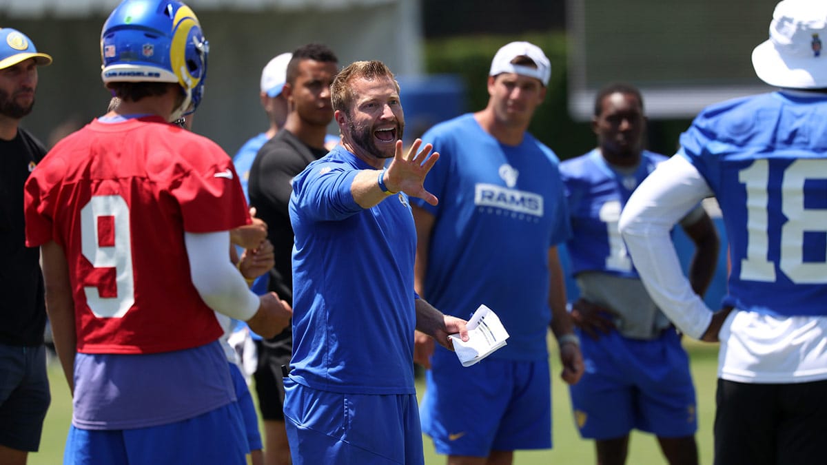 Los Angeles Rams head coach Sean McVay talks with players on the field during training camp at Loyola Marymount University.