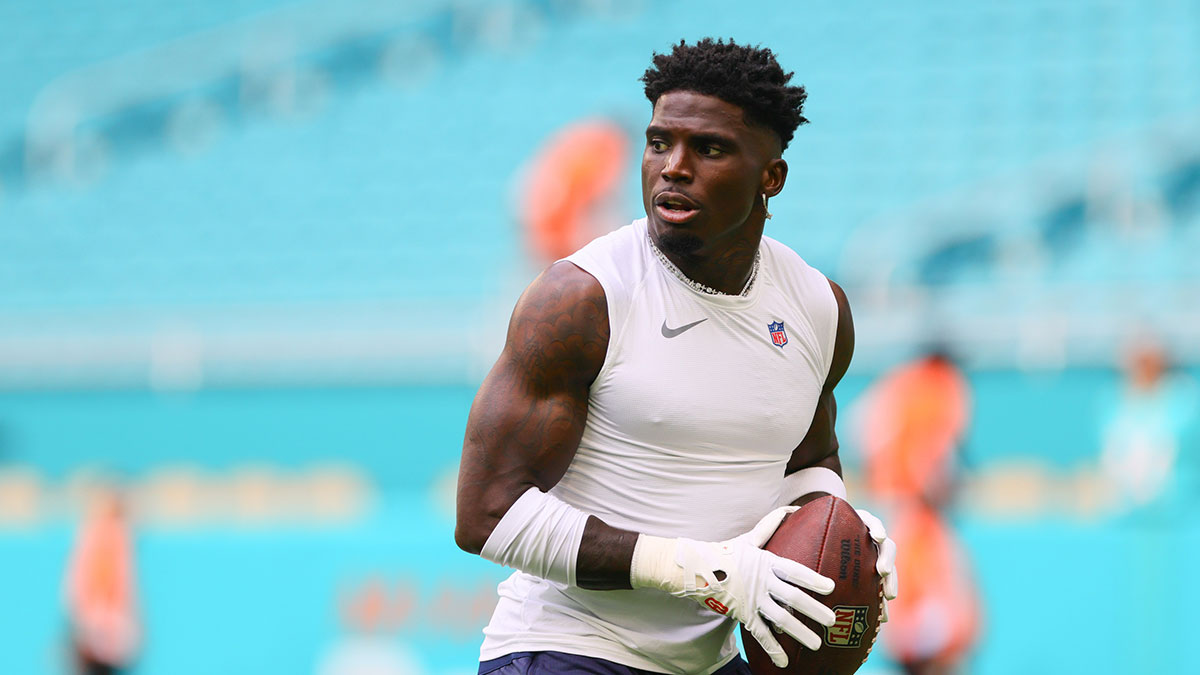 Miami Dolphins wide receiver Tyreek Hill (10) throws the football before preseason game against the Washington Commanders at Hard Rock Stadium.