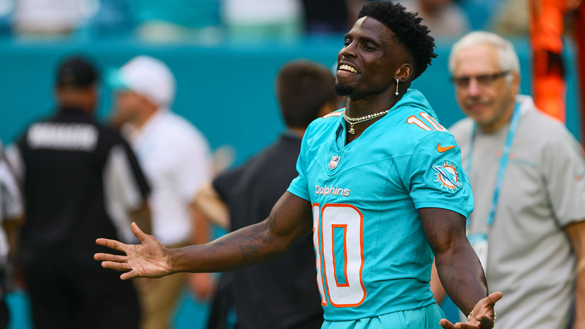 Miami Dolphins wide receiver Tyreek Hill (10) reacts as he walks on the field before the game against the Atlanta Falcons at Hard Rock Stadium.