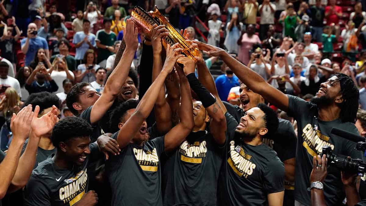 Miami Heat lift the 2025 Summer League Champions trophy after defeating the Memphis Grizzlies in overtime at Thomas & Mack Center.