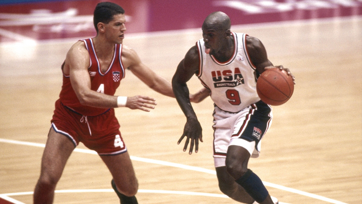 USA Dream Team guard Michael Jordan (9) is defended by Croatia guard Drazen Petrovic (4) in the mens basketball gold medal game during the 1992 Barcelona Olympic Games at Pavello Olympic Arena.