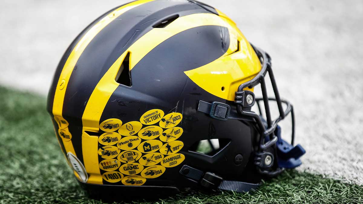 A Michigan football helmet on the field during warmup at the spring game at Michigan Stadium