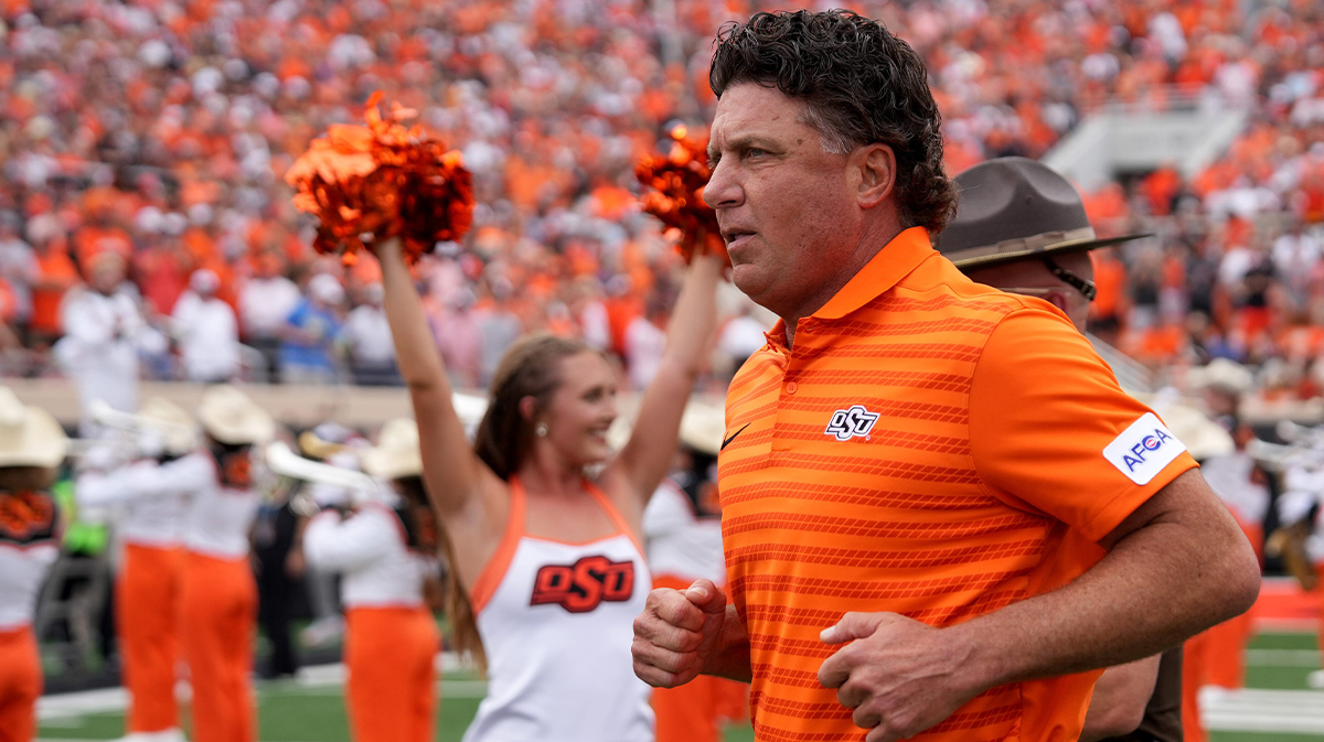 Oklahoma State head football coach Mike Gundy runs on to the field in the first half of the college football game between the Oklahoma State Cowboys and South Dakota State Jackrabbits at Boone Pickens Stadium in Stillwater, Okla., Saturday, Aug., 31, 2024.