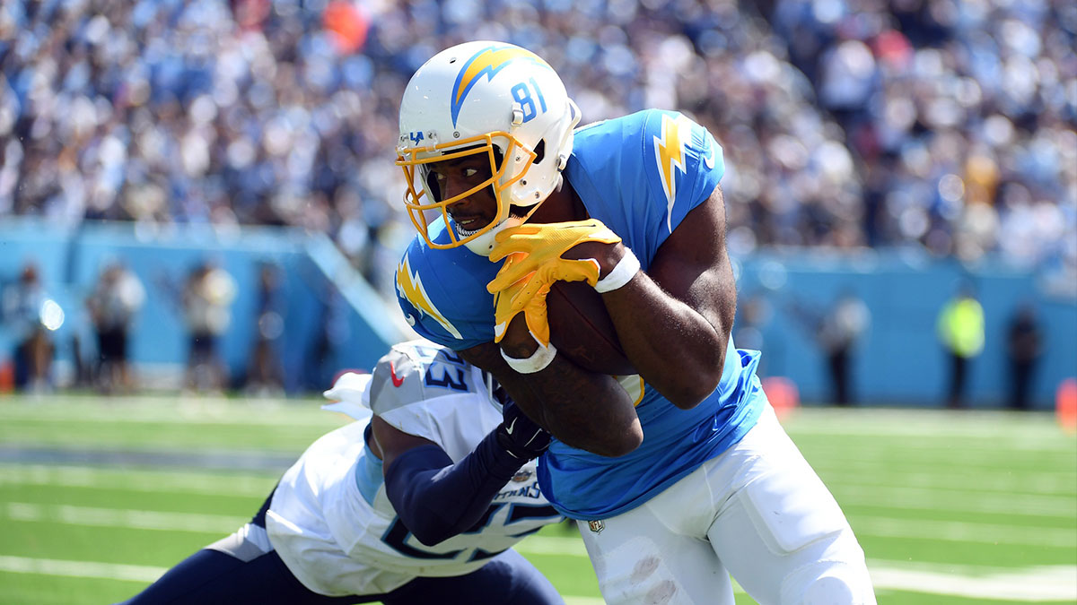 Los Angeles Chargers wide receiver Mike Williams (81) runs after a reception against Tennessee Titans cornerback Tre Avery (23) during the first half at Nissan Stadium.