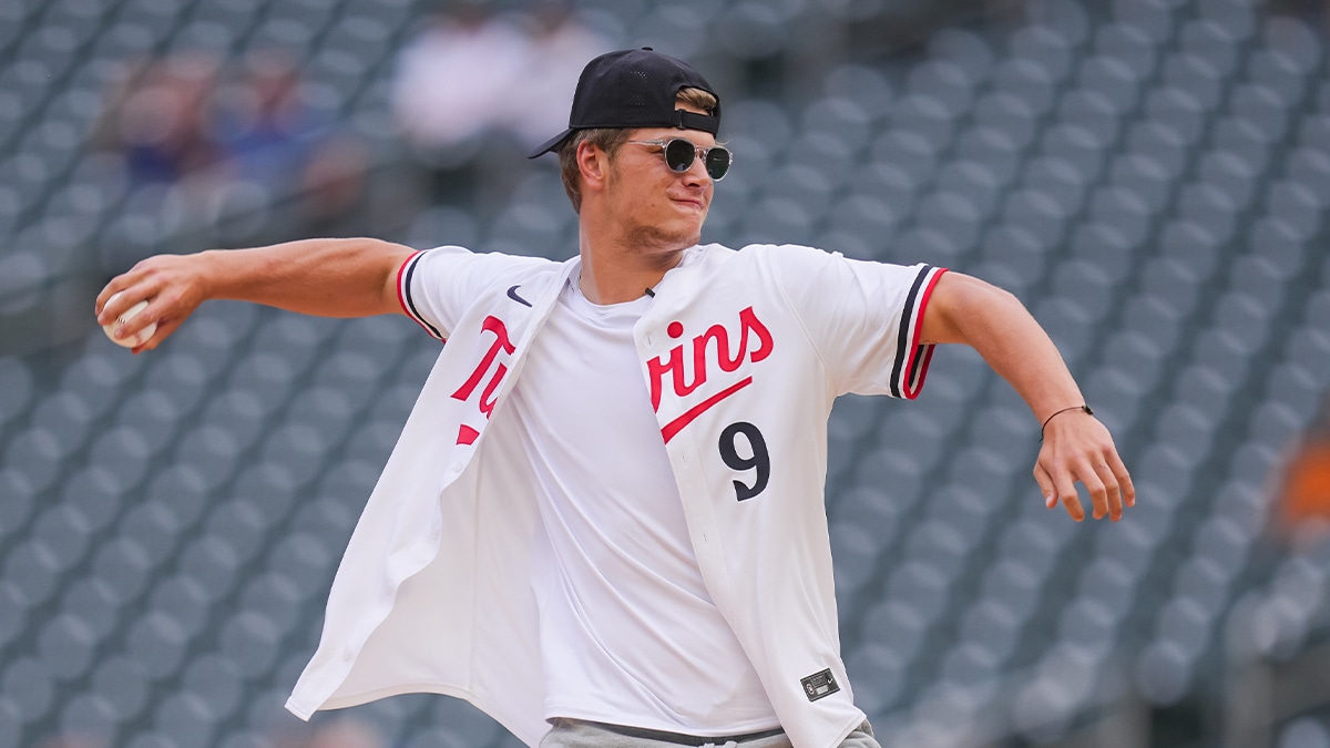 Jun 18, 2024; Minneapolis, Minnesota, USA; Minnesota Vikings first round draft pick JJ McCarthy throws out the ceremonial first pitch in a game between the Minnesota Twins and Tampa Bay Rays at Target Field. Mandatory Credit: Brad Rempel-USA TODAY Sports