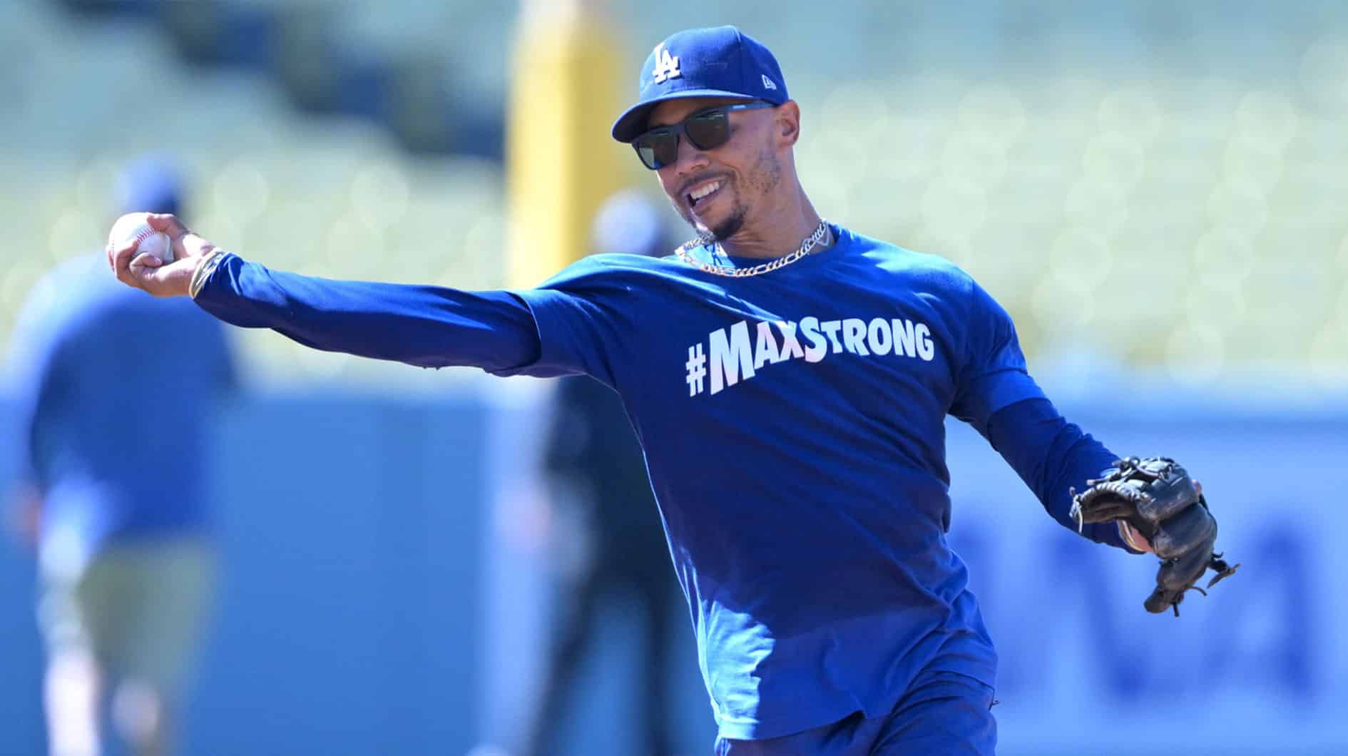 Los Angeles Dodgers second baseman Mookie Betts (50) fields ground balls prior to the game against the Philadelphia Phillies at Dodger Stadium. Dodger players wore #MaxStrong shirts during pregame to honor Max, the 3-year old son of first baseman Freddie Freeman (5), who was diagnosed with Guillian-Barre syndrome. 