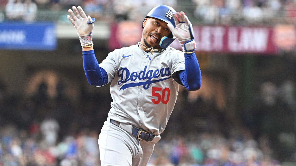  Los Angeles Dodgers right field Mookie Betts (50) rounds the bases after hitting a home run against the Milwaukee Brewers at American Family Field. 