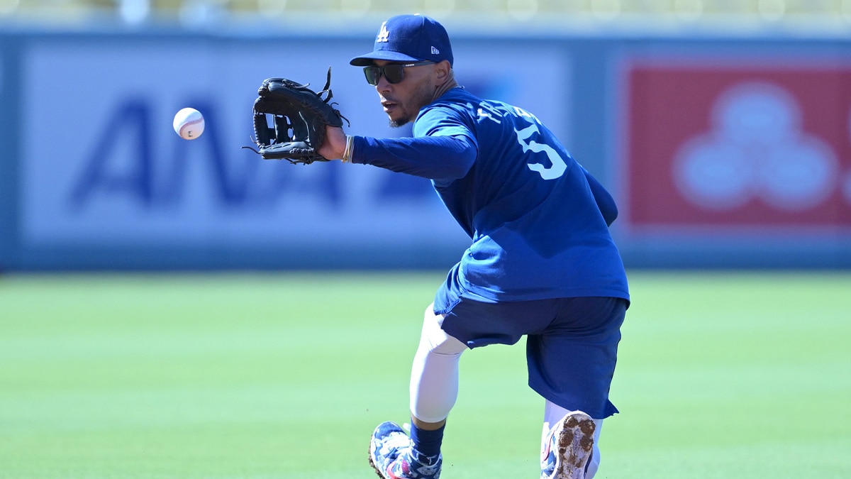 Los Angeles Dodgers second baseman Mookie Betts (50) fields ground balls prior to the game against the Philadelphia Phillies at Dodger Stadium. Dodger players wore #MaxStrong shirts during pregame to honor Max, the 3-year old son of first baseman Freddie Freeman (5), who was diagnosed with Guillian-Barre syndrome.