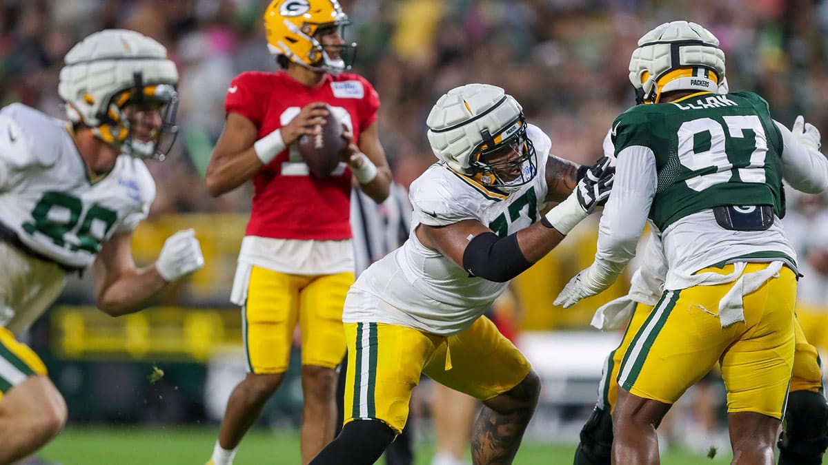 Green Bay Packers offensive lineman Jordan Morgan (77) blocks defensive lineman Kenny Clark (97) during Family Night on Saturday, August 3, 2024, at Lambeau Field in Green Bay, Wis.