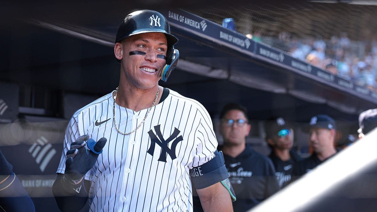 Aug 11, 2024; Bronx, New York, USA; New York Yankees center fielder Aaron Judge (99) reacts in the dugout after his solo home run during the seventh inning against the Texas Rangers at Yankee Stadium. Mandatory Credit: Vincent Carchietta-USA TODAY Sports