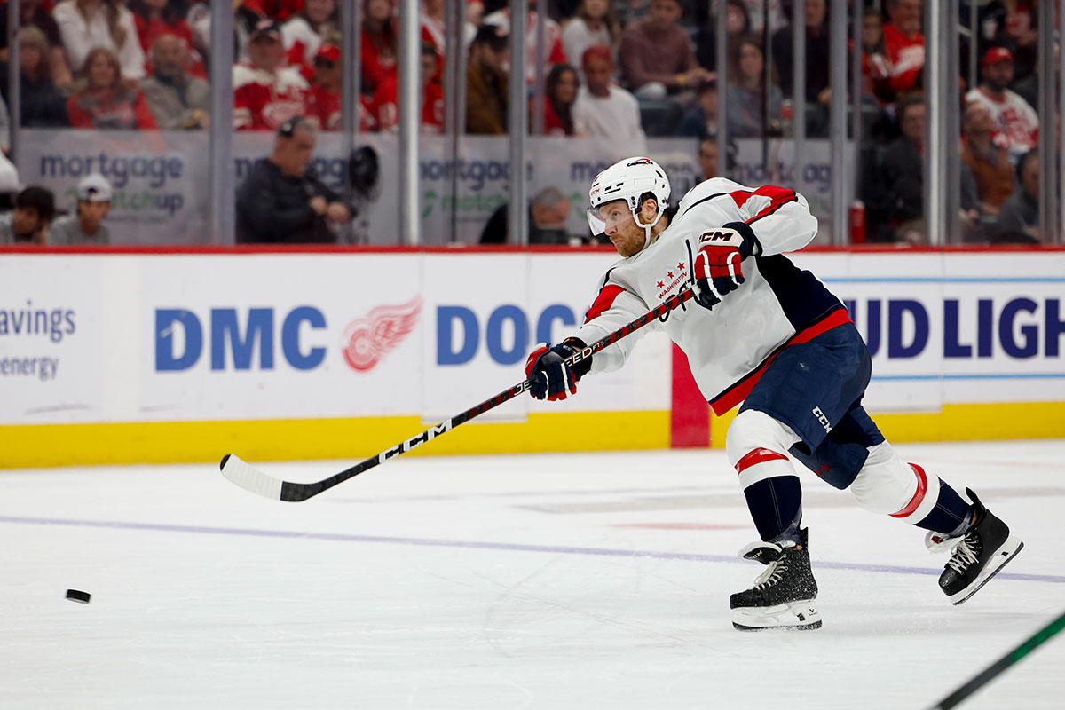 Washington Capitals defenseman Nick Jensen (3) takes a shot in the third period against the Detroit Red Wings at Little Caesars Arena.